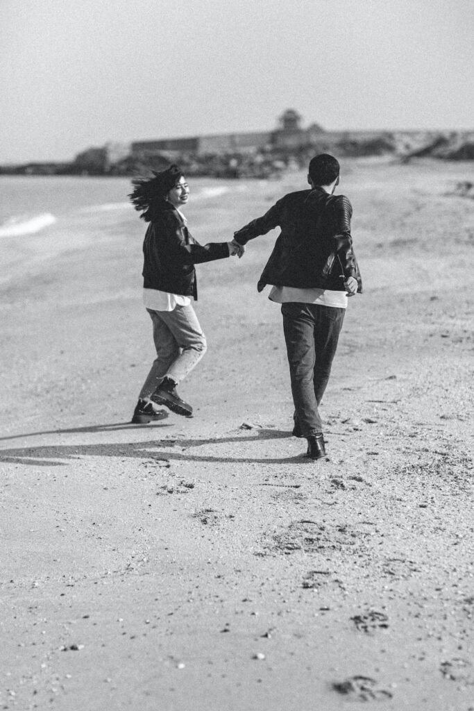 Young Couple Running on the Beach