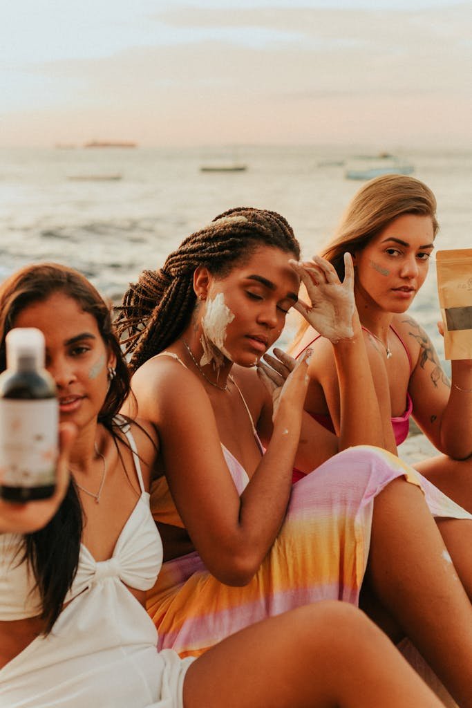 Women Testing Skincare on a Beach